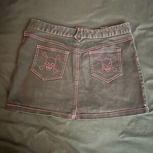Beauty Fiend black denim mini skirt with skull pockets